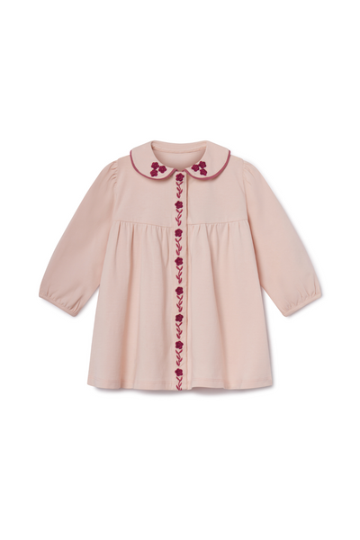 Pink children's dress with floral embroidery on a white background
