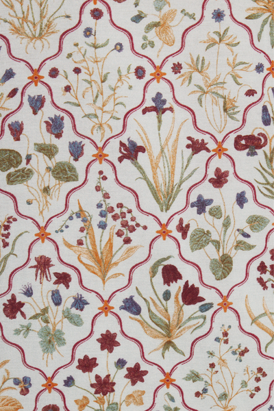 Patterned fabric with floral design and geometric shapes on a white background