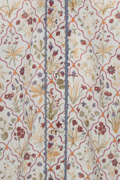 Floral patterned fabric with a blue stripe running through it