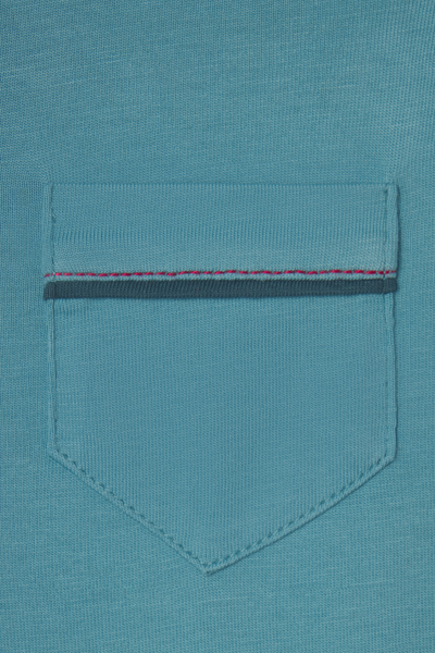 Close-up of a teal pocket with a contrasting band on a teal background