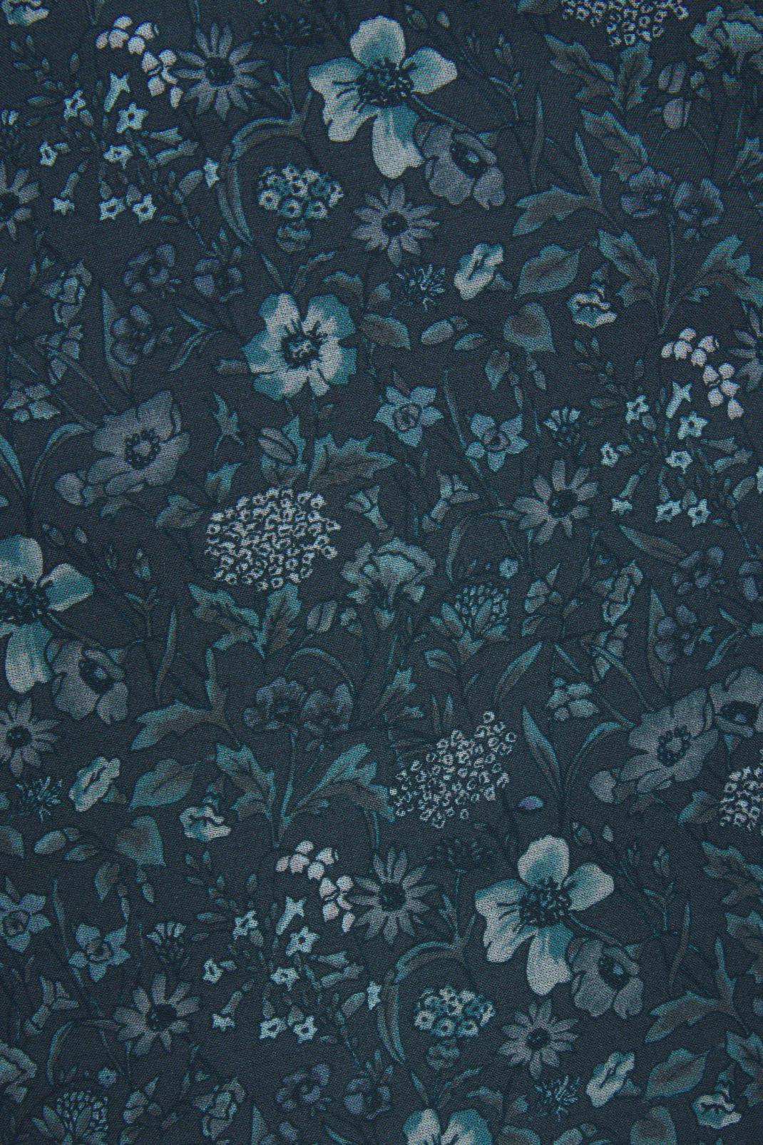 Floral pattern with blue flowers on a dark background