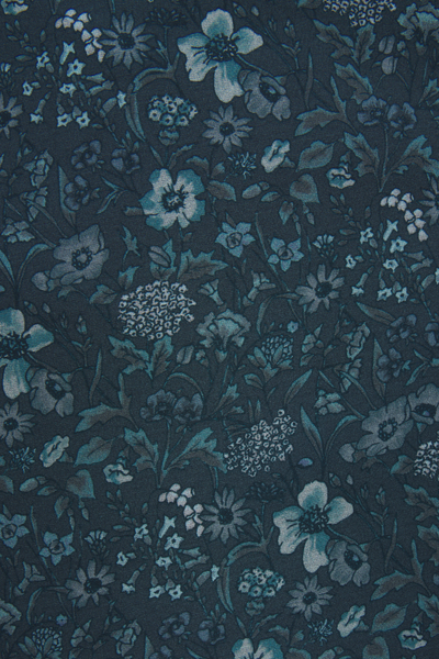 Floral pattern with blue flowers on a dark background