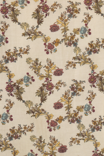 Floral patterned fabric with multicolored flowers on a beige background