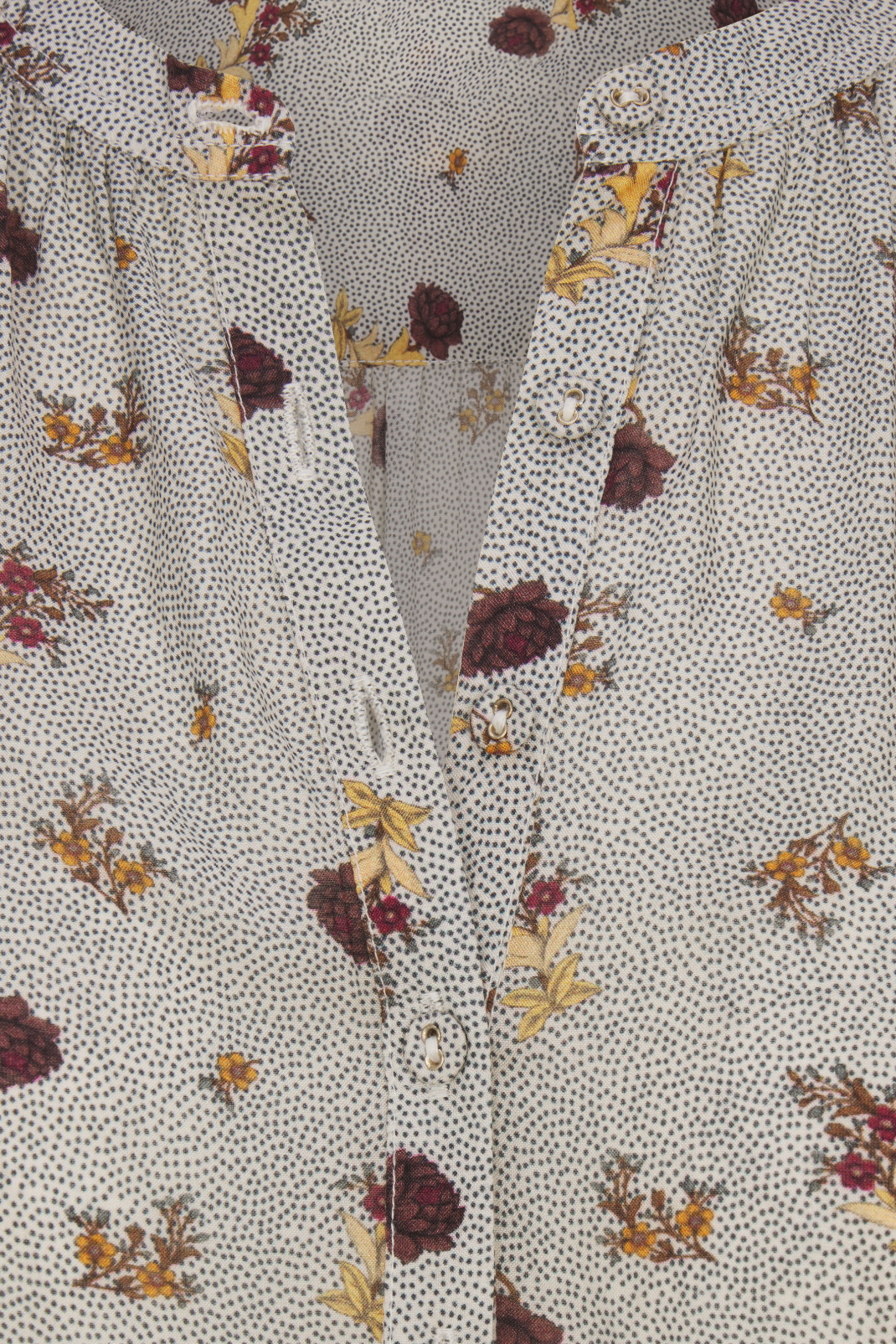 Close-up of a fabric with a floral pattern on a neutral background