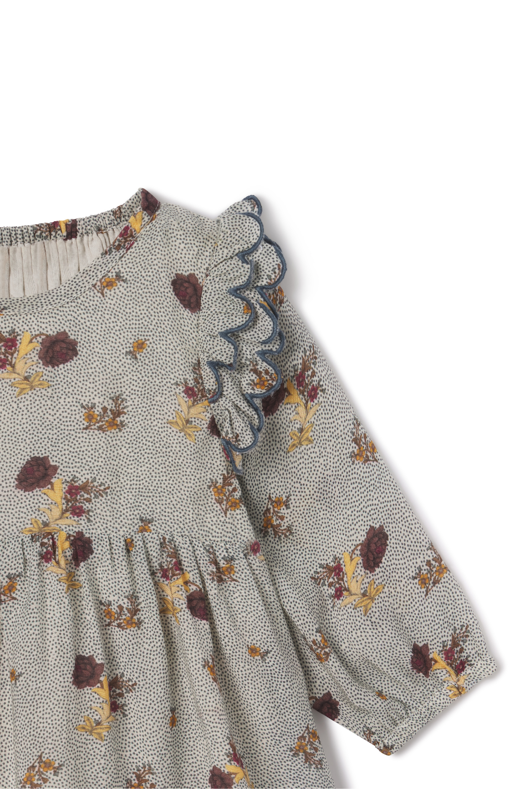 Floral patterned dress with long sleeves on a white background