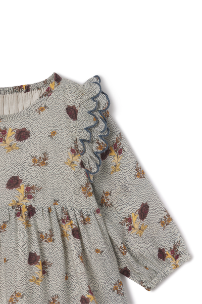 Floral patterned dress with long sleeves on a white background