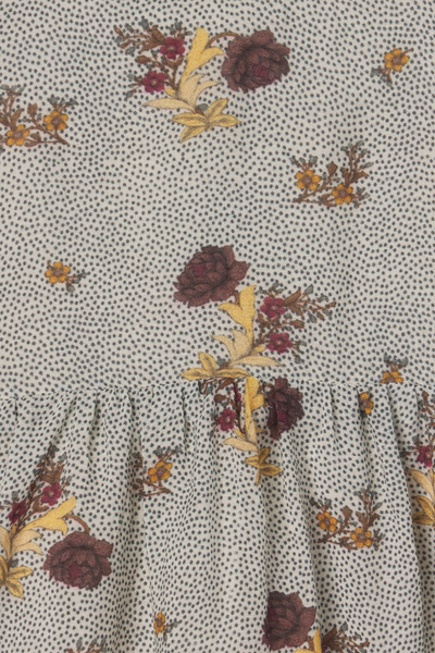 Floral patterned fabric with a subtle dot background