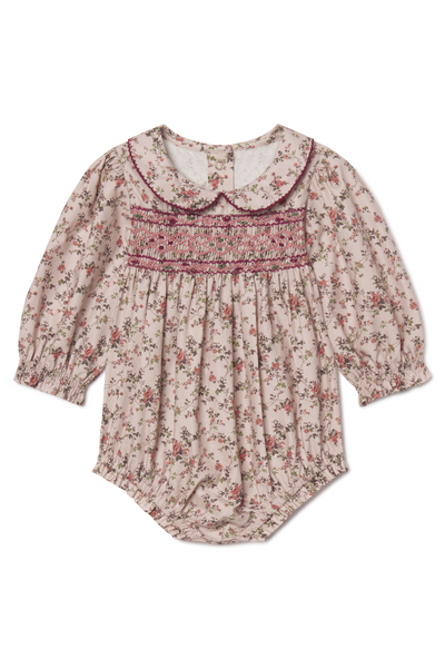 Floral baby romper with a collar on a white background