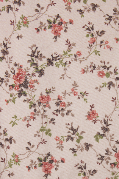 Floral pattern with pink flowers and green leaves on a beige background