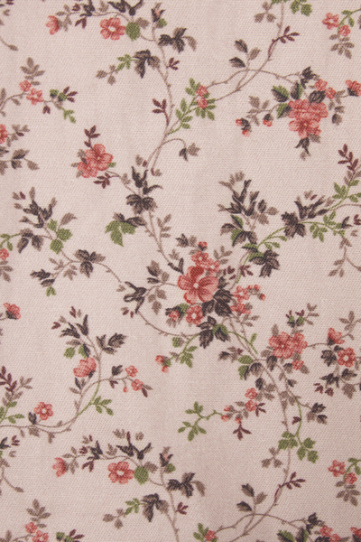 Floral pattern with pink and red flowers on a beige background