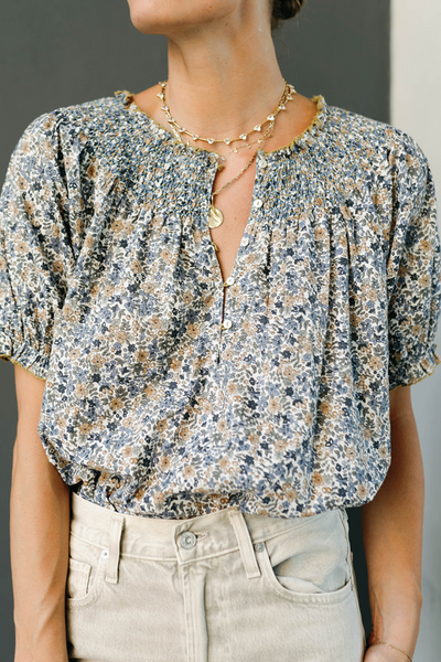 Woman in a blue floral top