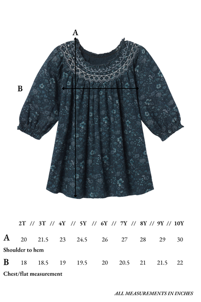 Children's dress with measurement chart on a white background