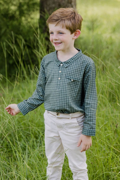 Lifestyle image of a little boy wearing the Phillip Popover in Eucalipto Check