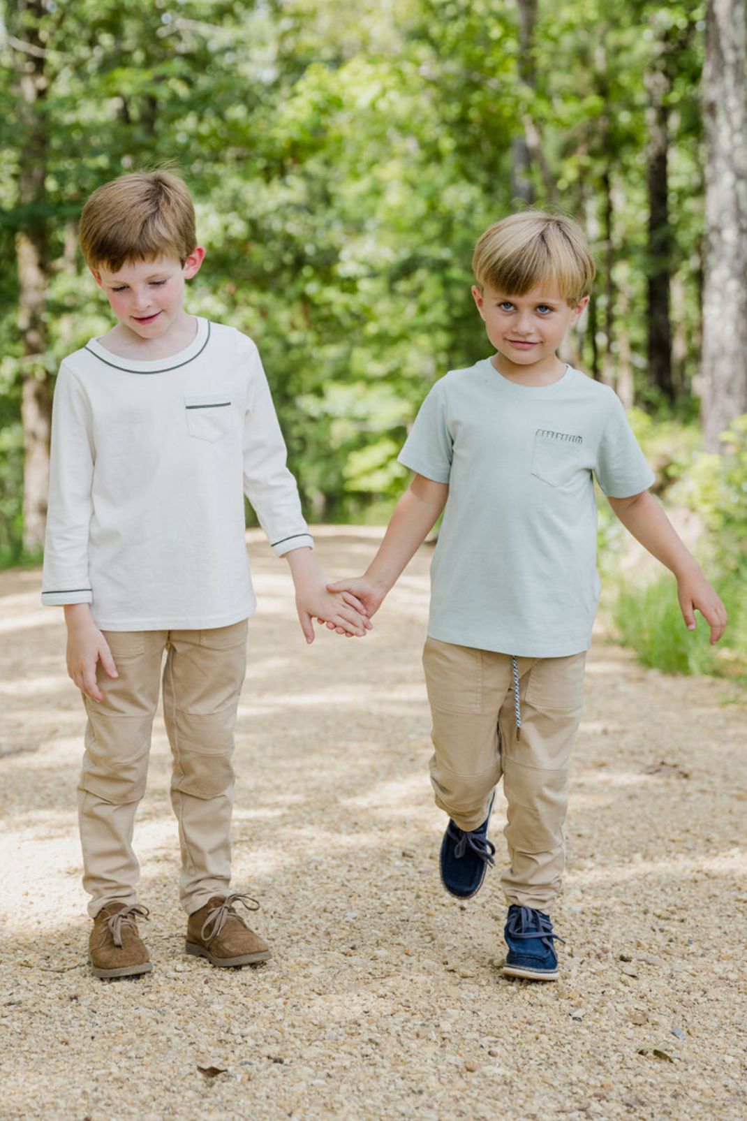 Lifestyle shot of two boys walking one wearing the Henry T-Shirt in Pigeon with Thyme