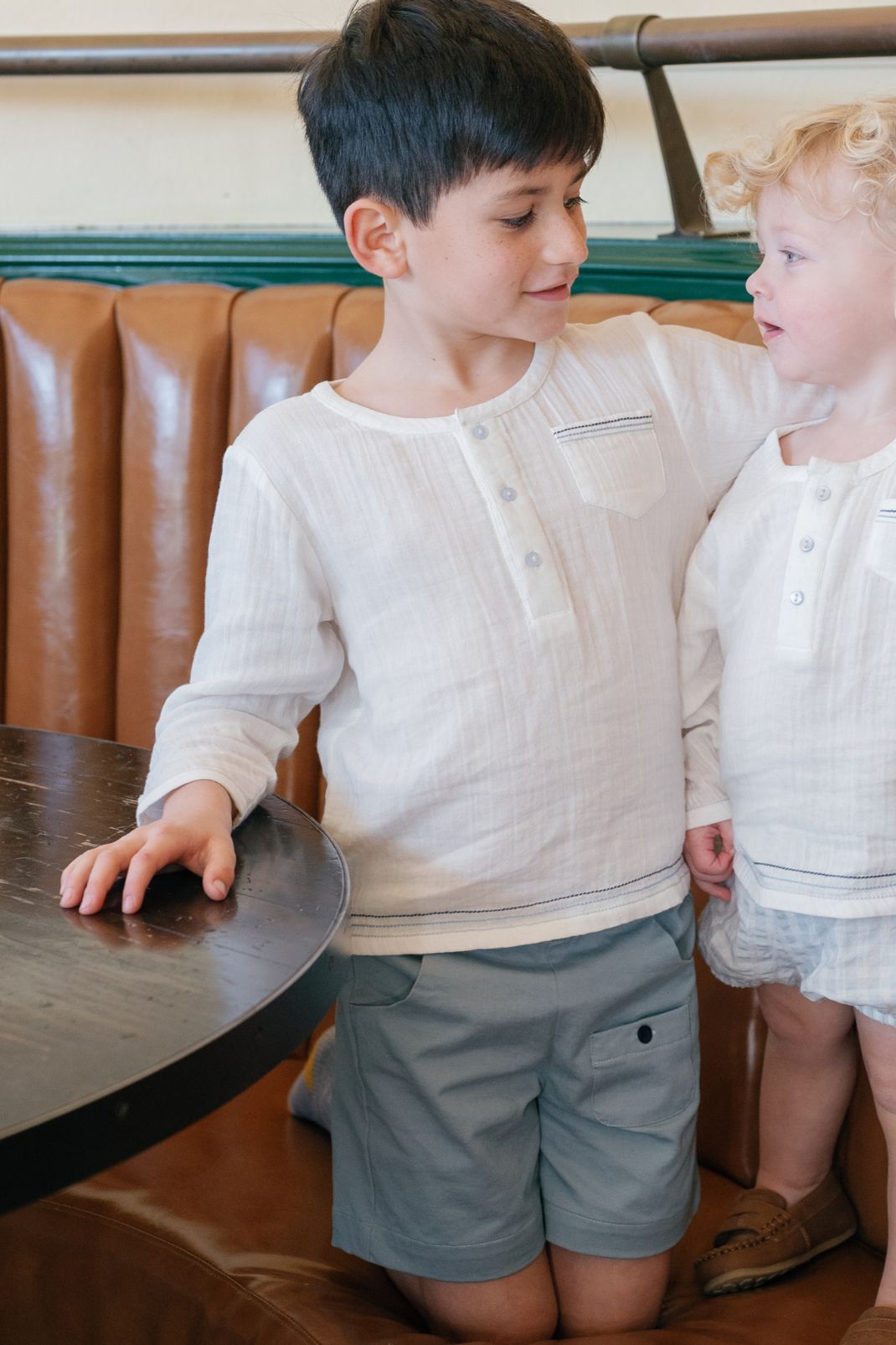 Close up shot of a little boy wearing the Graham Shorts in Pearl Blue
