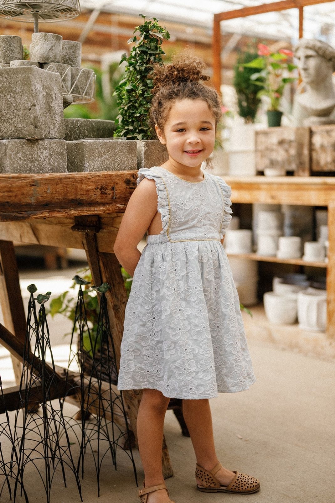 Little girl wearing the Elizabeth Dress in Sky Anemone Embroidery