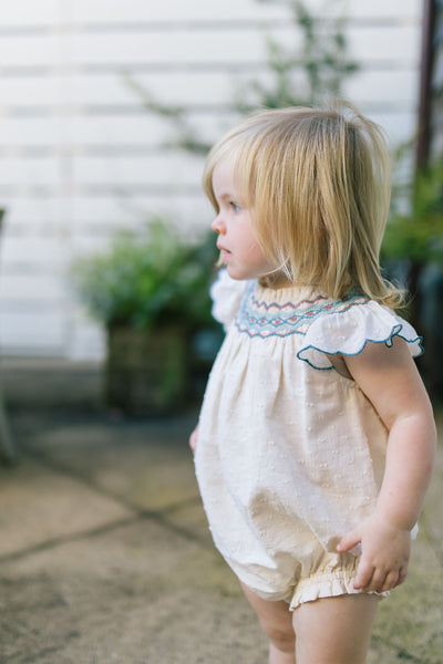 Little girl standing outside in the Daisy Bubble